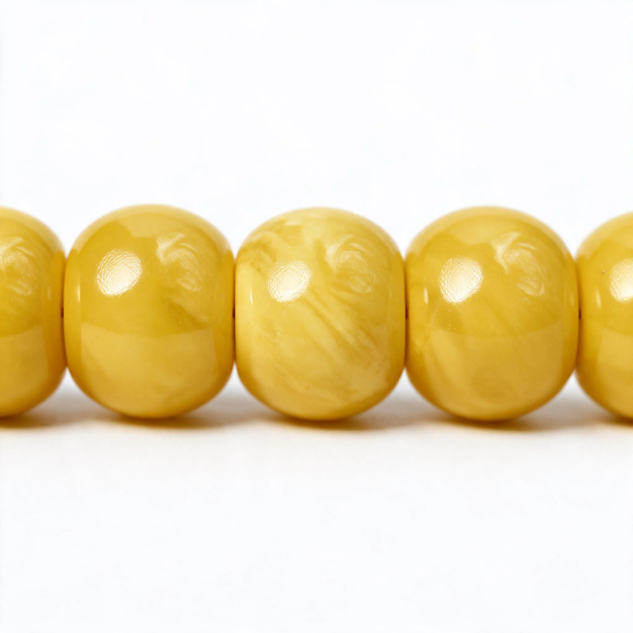 – authentic-silver-inlaid-kok-beads-detail-k4 Close-up of Vintage Modified Yellow Amber Beads 14.5x12mm Showing Rich Color Inclusions {A16}